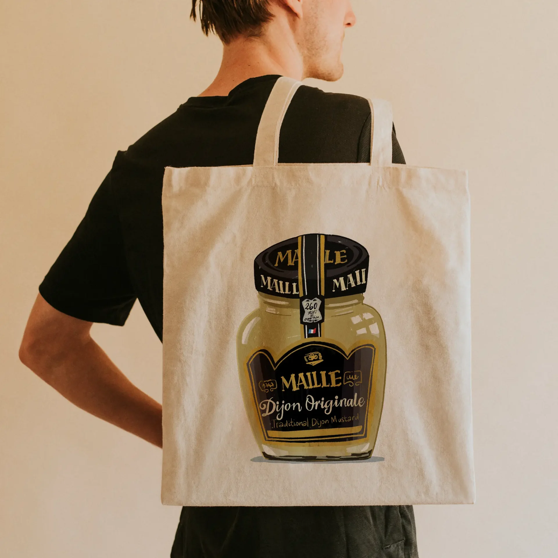 Tote bag featuring a digital illustration of a Maille Dijon mustard jar, created by Marta Piedra.
